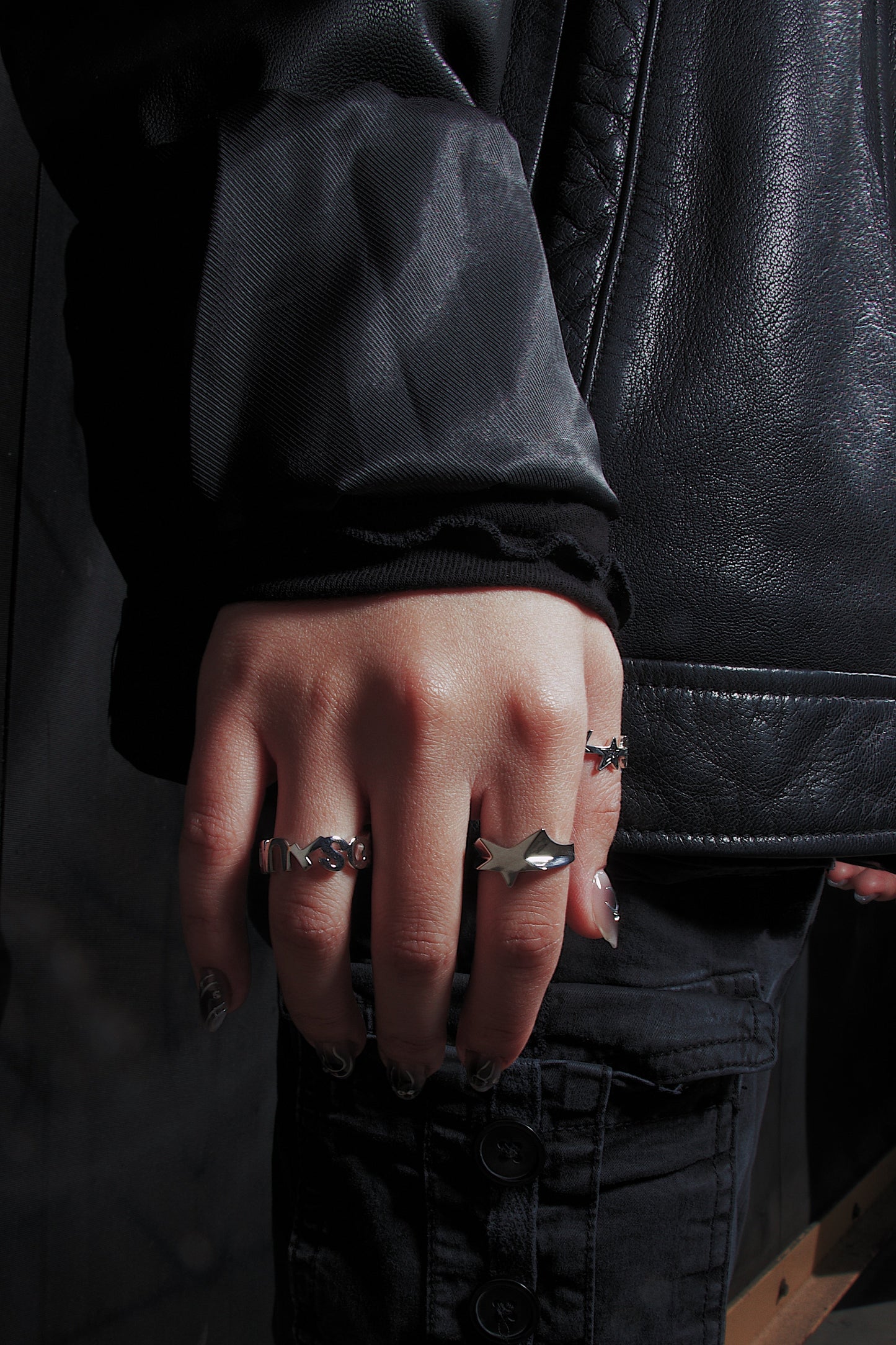 Premium handcrafted silver ring spelling out Sluco Studio